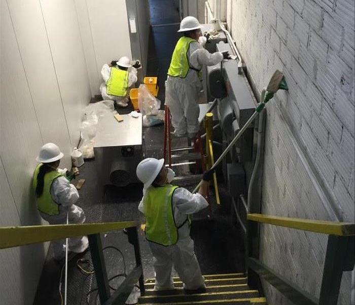 workers cleaning walls