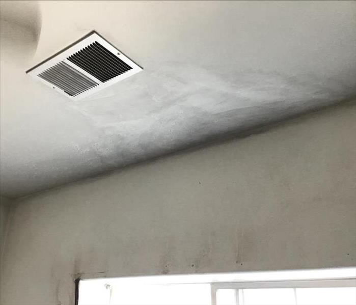 A ceiling with smoke damage